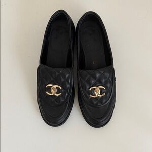 CHANEL Quilted Black Loafers with Gold Emblem